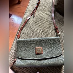 Olive green Dooney & Bourke satchel with red interior